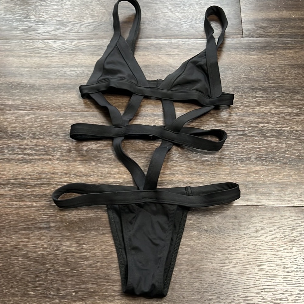 Really sexy black strappy clasp swimsuit. Clasps in back. Looks amazing on. Sz S - Picture 2 of 5